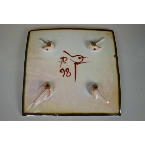 421 - A Sitzendorf wall pocket with cherub Decoration, two floral wall pockets, a ceramic art pottery bowl... 