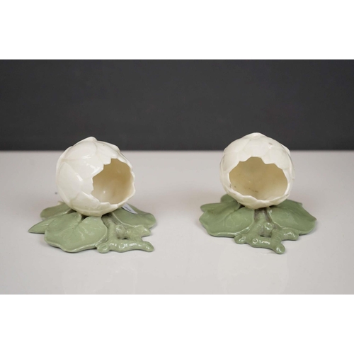 421 - A Sitzendorf wall pocket with cherub Decoration, two floral wall pockets, a ceramic art pottery bowl... 