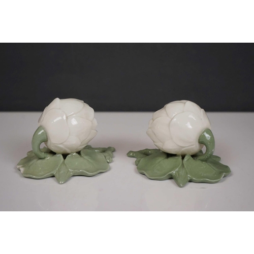 421 - A Sitzendorf wall pocket with cherub Decoration, two floral wall pockets, a ceramic art pottery bowl... 