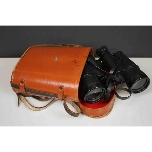 422 - A collection three pairs of modern binoculars together with a pair of opera glasses.