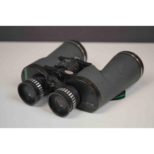 422 - A collection three pairs of modern binoculars together with a pair of opera glasses.