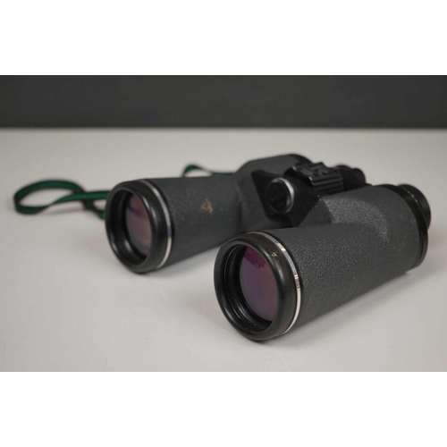 422 - A collection three pairs of modern binoculars together with a pair of opera glasses.