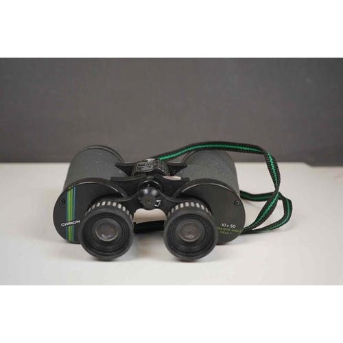 422 - A collection three pairs of modern binoculars together with a pair of opera glasses.