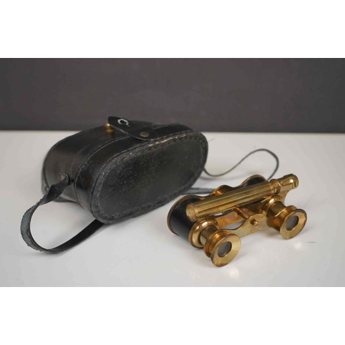 422 - A collection three pairs of modern binoculars together with a pair of opera glasses.