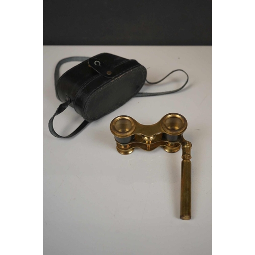 422 - A collection three pairs of modern binoculars together with a pair of opera glasses.