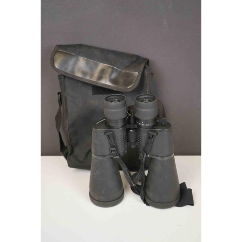 422 - A collection three pairs of modern binoculars together with a pair of opera glasses.