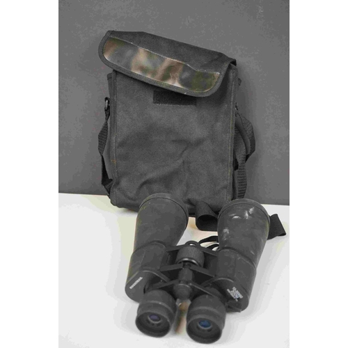 422 - A collection three pairs of modern binoculars together with a pair of opera glasses.