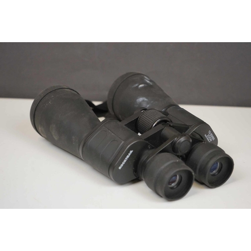 422 - A collection three pairs of modern binoculars together with a pair of opera glasses.