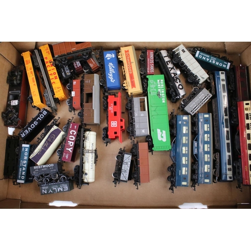 9 - Collection of 38 OO gauge items of rolling stock featuring mainly trucks and wagons to include Trian... 