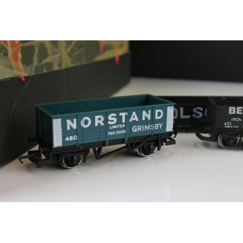 9 - Collection of 38 OO gauge items of rolling stock featuring mainly trucks and wagons to include Trian... 