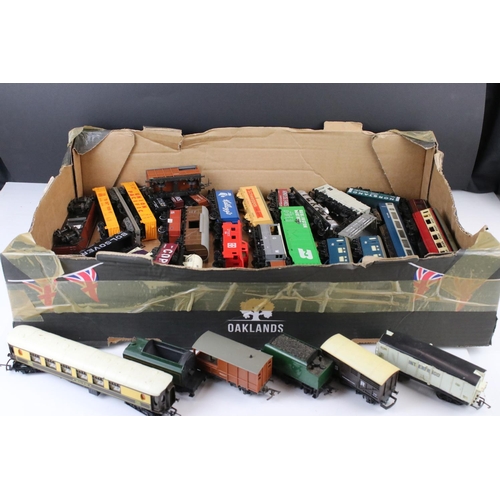 9 - Collection of 38 OO gauge items of rolling stock featuring mainly trucks and wagons to include Trian... 