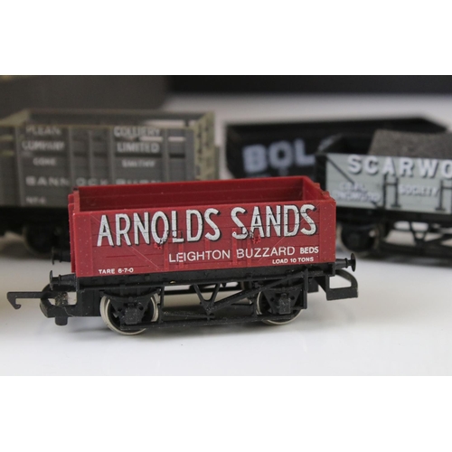 9 - Collection of 38 OO gauge items of rolling stock featuring mainly trucks and wagons to include Trian... 