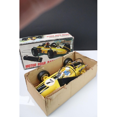 211 - Boxed Battery Operated r/c Motor Roar Racer plastic car, in yellow, with driver, gd overall, box fai... 