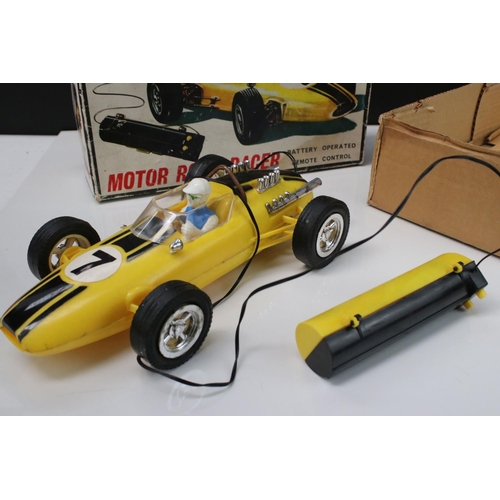 211 - Boxed Battery Operated r/c Motor Roar Racer plastic car, in yellow, with driver, gd overall, box fai... 
