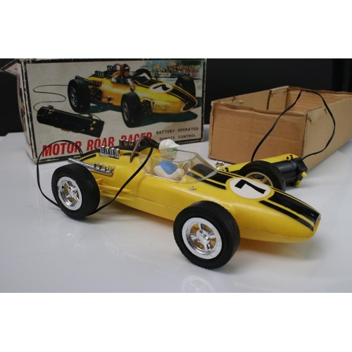 211 - Boxed Battery Operated r/c Motor Roar Racer plastic car, in yellow, with driver, gd overall, box fai... 