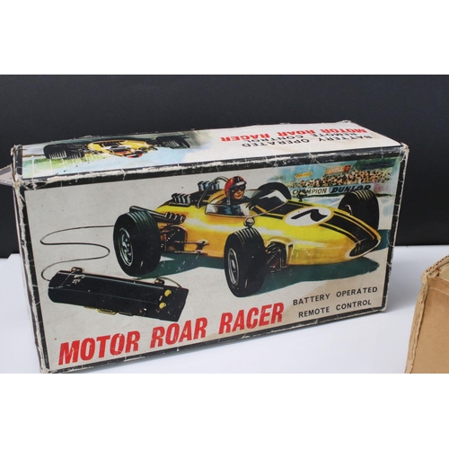 211 - Boxed Battery Operated r/c Motor Roar Racer plastic car, in yellow, with driver, gd overall, box fai... 