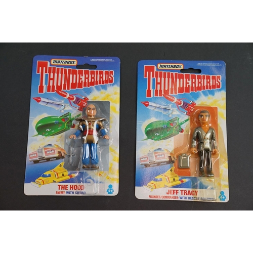 202 - 15 Carded Matchbox Thunderbirds figures in vg condition, some duplicated but onto different design c... 