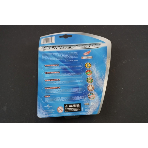 203 - Thunderbirds - Seven cardedBandai / FEVA Thunderbird diecast models plus 3 x unopened 4 packs of Thu... 