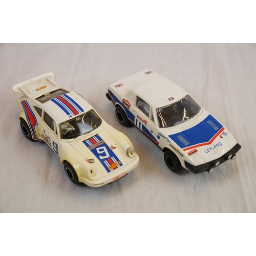 218 - Quantity of Scalextric track, plus five playworn slot cars and two controllers
