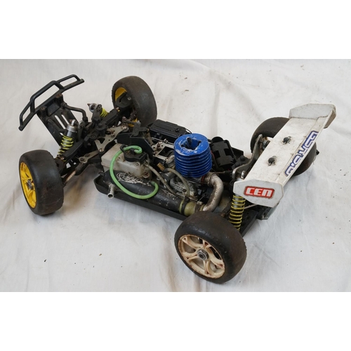 402 - A RC car buggy 1/8 scale Protech Ultrex Evo Nitro 0.21 4WD engine together with a CEN GSR 5.0 Nitro ... 