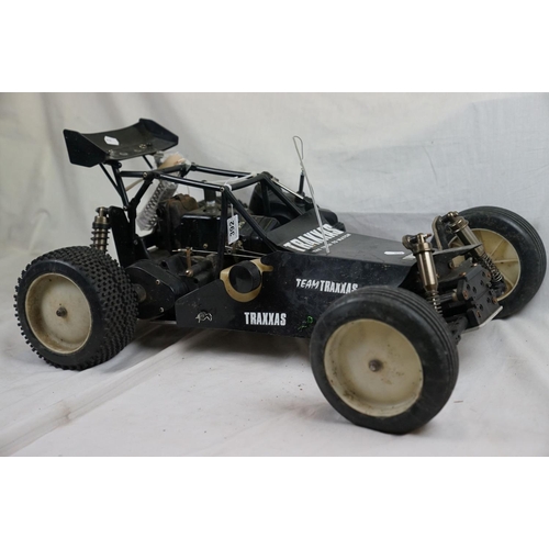 402 - A RC car buggy 1/8 scale Protech Ultrex Evo Nitro 0.21 4WD engine together with a CEN GSR 5.0 Nitro ... 