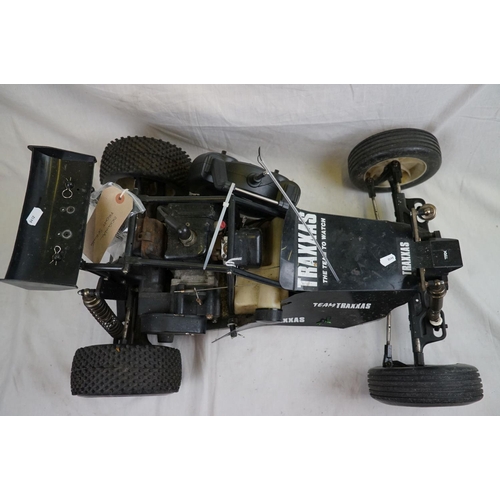 402 - A RC car buggy 1/8 scale Protech Ultrex Evo Nitro 0.21 4WD engine together with a CEN GSR 5.0 Nitro ... 