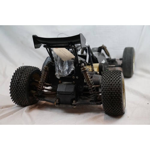 402 - A RC car buggy 1/8 scale Protech Ultrex Evo Nitro 0.21 4WD engine together with a CEN GSR 5.0 Nitro ... 
