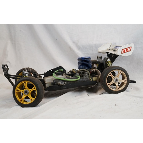402 - A RC car buggy 1/8 scale Protech Ultrex Evo Nitro 0.21 4WD engine together with a CEN GSR 5.0 Nitro ... 