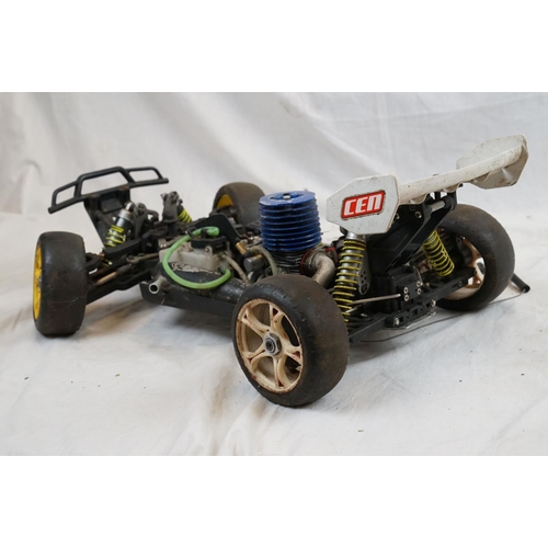 402 - A RC car buggy 1/8 scale Protech Ultrex Evo Nitro 0.21 4WD engine together with a CEN GSR 5.0 Nitro ... 
