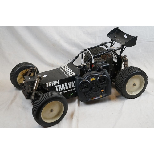 402 - A RC car buggy 1/8 scale Protech Ultrex Evo Nitro 0.21 4WD engine together with a CEN GSR 5.0 Nitro ... 