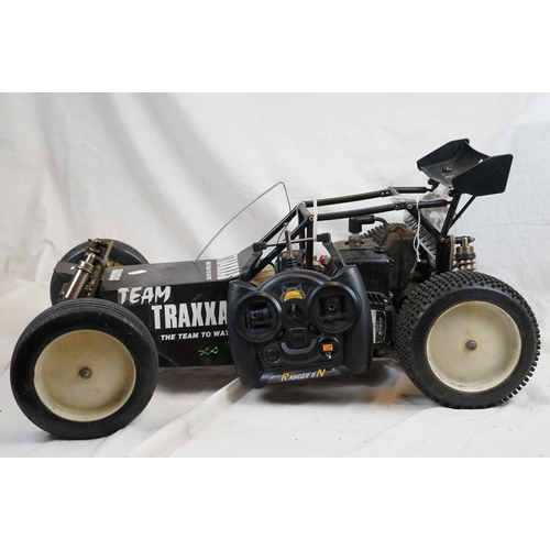 402 - A RC car buggy 1/8 scale Protech Ultrex Evo Nitro 0.21 4WD engine together with a CEN GSR 5.0 Nitro ... 