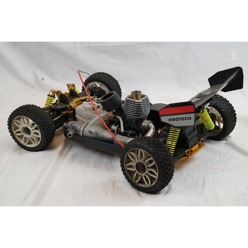402 - A RC car buggy 1/8 scale Protech Ultrex Evo Nitro 0.21 4WD engine together with a CEN GSR 5.0 Nitro ... 