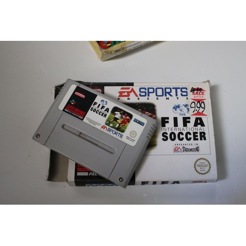 194 - Retro Gaming - Boxed Super Nintendo SNES console with one controller and Super Mario World cartridge... 