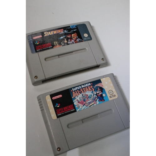 194 - Retro Gaming - Boxed Super Nintendo SNES console with one controller and Super Mario World cartridge... 