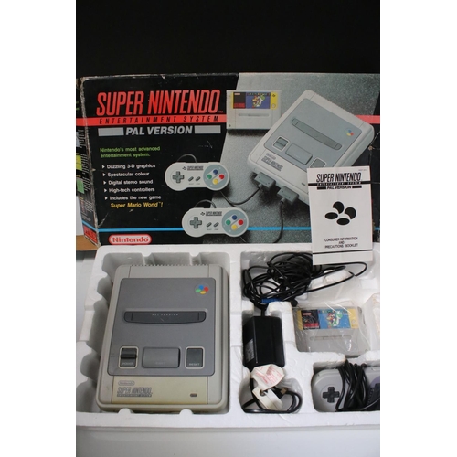 194 - Retro Gaming - Boxed Super Nintendo SNES console with one controller and Super Mario World cartridge... 