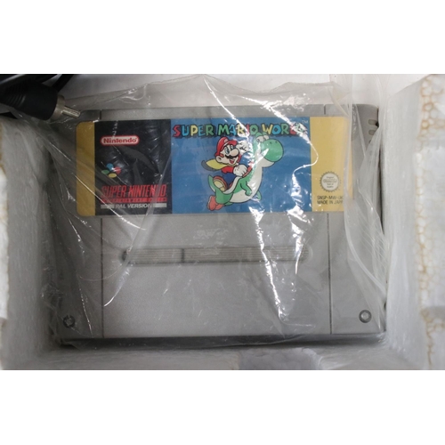 194 - Retro Gaming - Boxed Super Nintendo SNES console with one controller and Super Mario World cartridge... 
