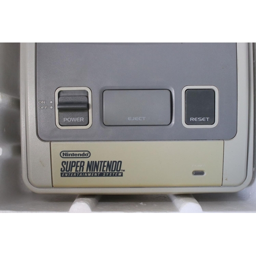 194 - Retro Gaming - Boxed Super Nintendo SNES console with one controller and Super Mario World cartridge... 