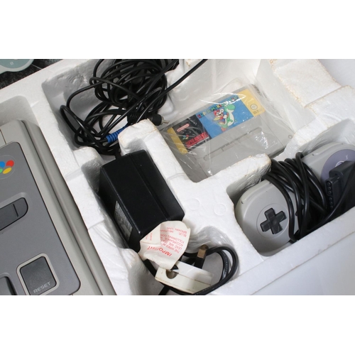 194 - Retro Gaming - Boxed Super Nintendo SNES console with one controller and Super Mario World cartridge... 
