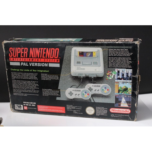 194 - Retro Gaming - Boxed Super Nintendo SNES console with one controller and Super Mario World cartridge... 