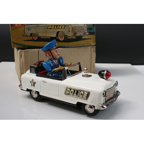 220 - Boxed Nomura TN Trade Mark (Japan) tin plate Battery Powered Mystery Police Car in vg condition, bat... 