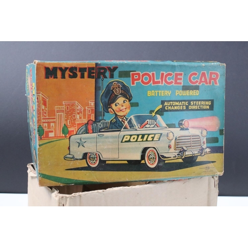 220 - Boxed Nomura TN Trade Mark (Japan) tin plate Battery Powered Mystery Police Car in vg condition, bat... 