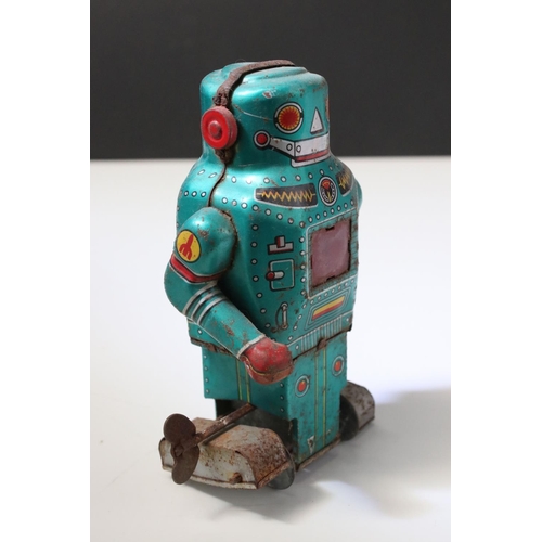 228 - Collection of ten tin plate toys, to include clockwork car,  robots, mouse photographer, elephant on... 