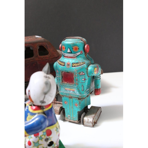 228 - Collection of ten tin plate toys, to include clockwork car,  robots, mouse photographer, elephant on... 