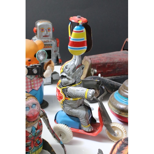 228 - Collection of ten tin plate toys, to include clockwork car,  robots, mouse photographer, elephant on... 