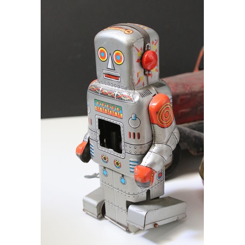 228 - Collection of ten tin plate toys, to include clockwork car,  robots, mouse photographer, elephant on... 