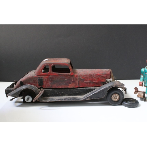 228 - Collection of ten tin plate toys, to include clockwork car,  robots, mouse photographer, elephant on... 