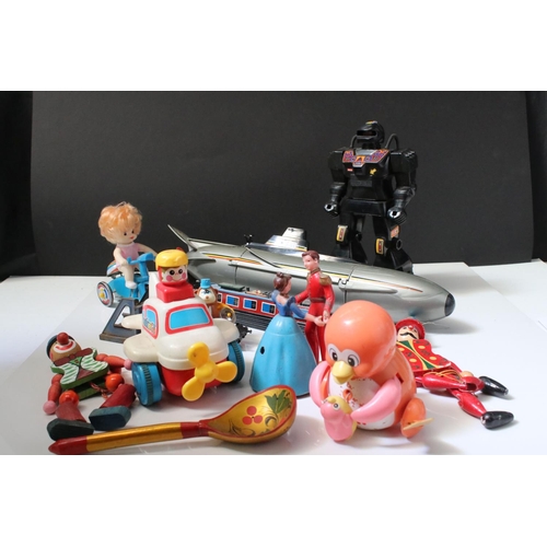 229 - Group of mixed toys to include wooden puppets, plastic robot, plastic submarine etc