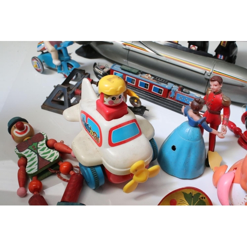229 - Group of mixed toys to include wooden puppets, plastic robot, plastic submarine etc