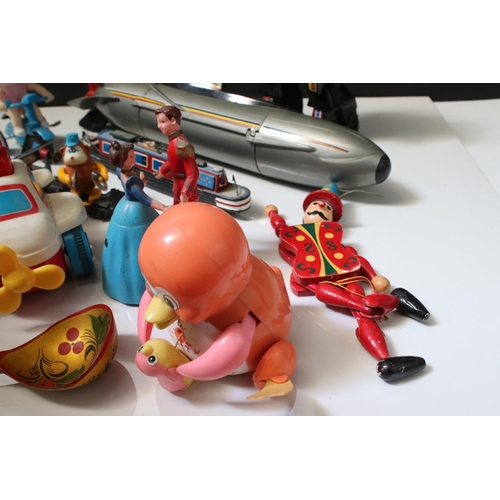 229 - Group of mixed toys to include wooden puppets, plastic robot, plastic submarine etc