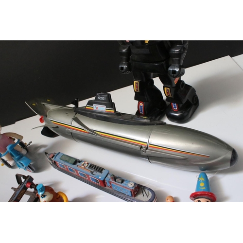 229 - Group of mixed toys to include wooden puppets, plastic robot, plastic submarine etc